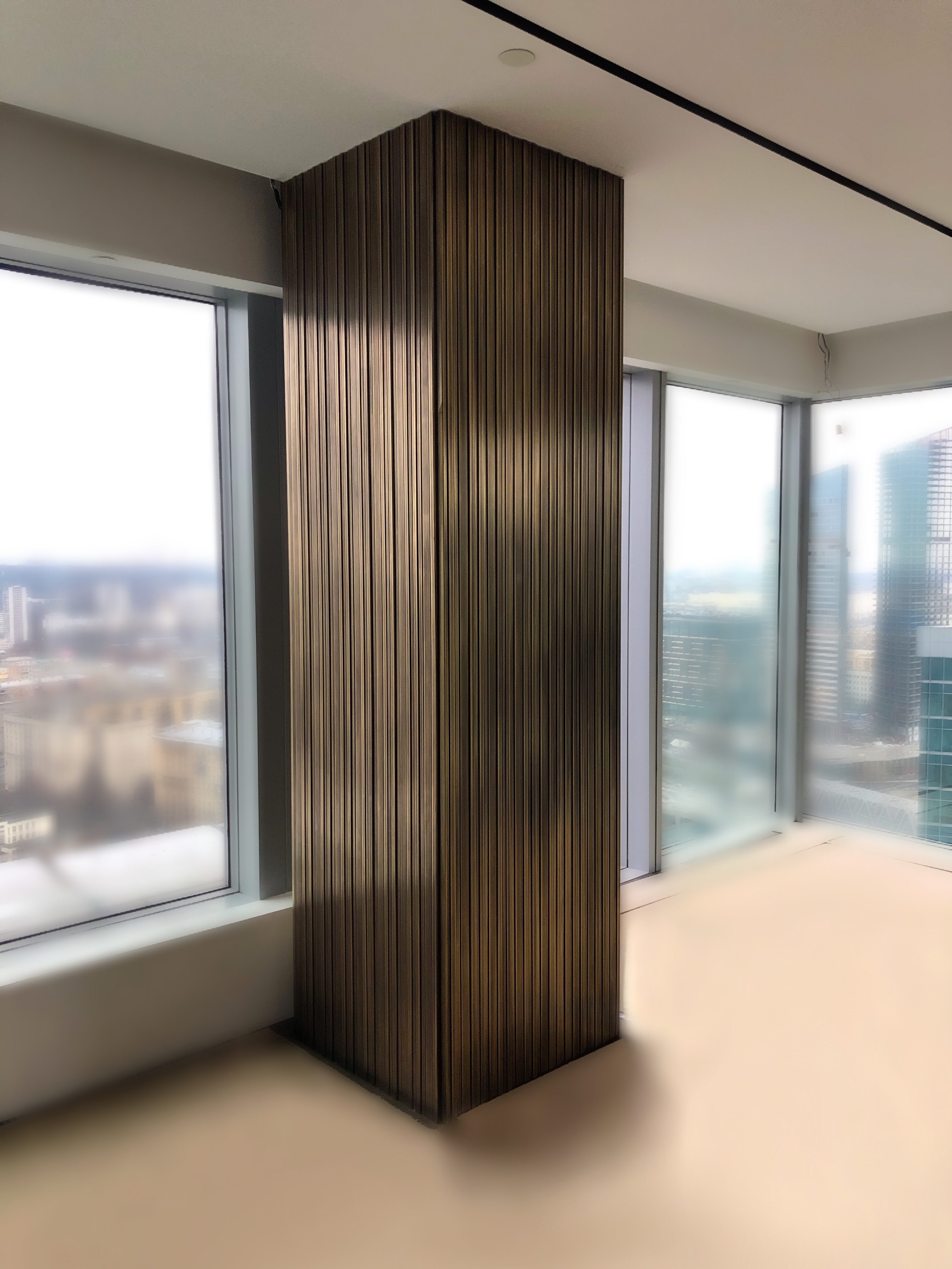 Латунная облицовка колонн и стен в Москва Сити